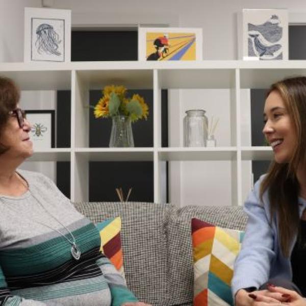 Two people talking in an office